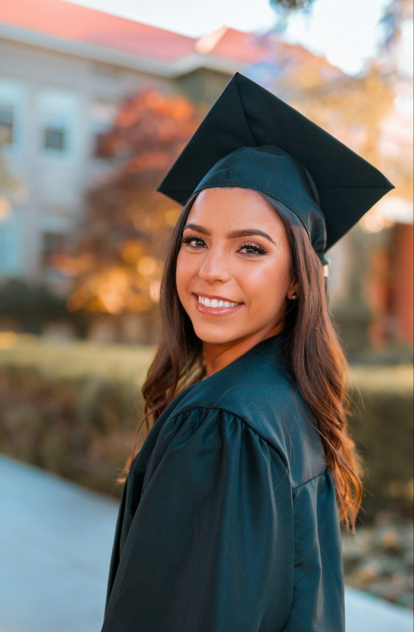 Female graduate smiling at the camera