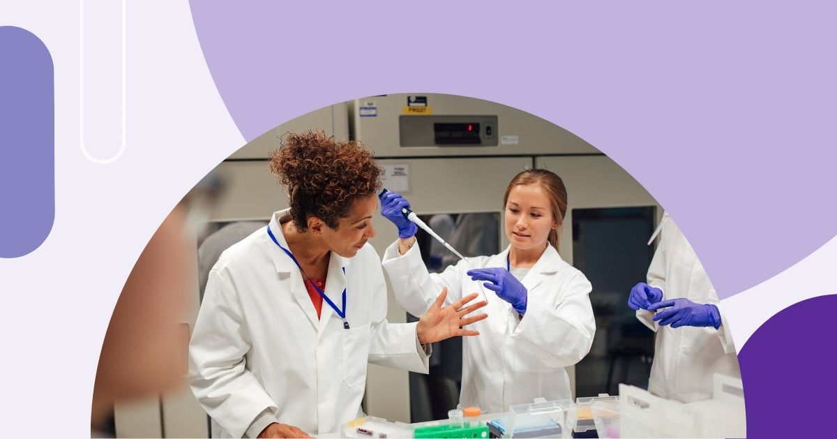 Two female students in lab coats