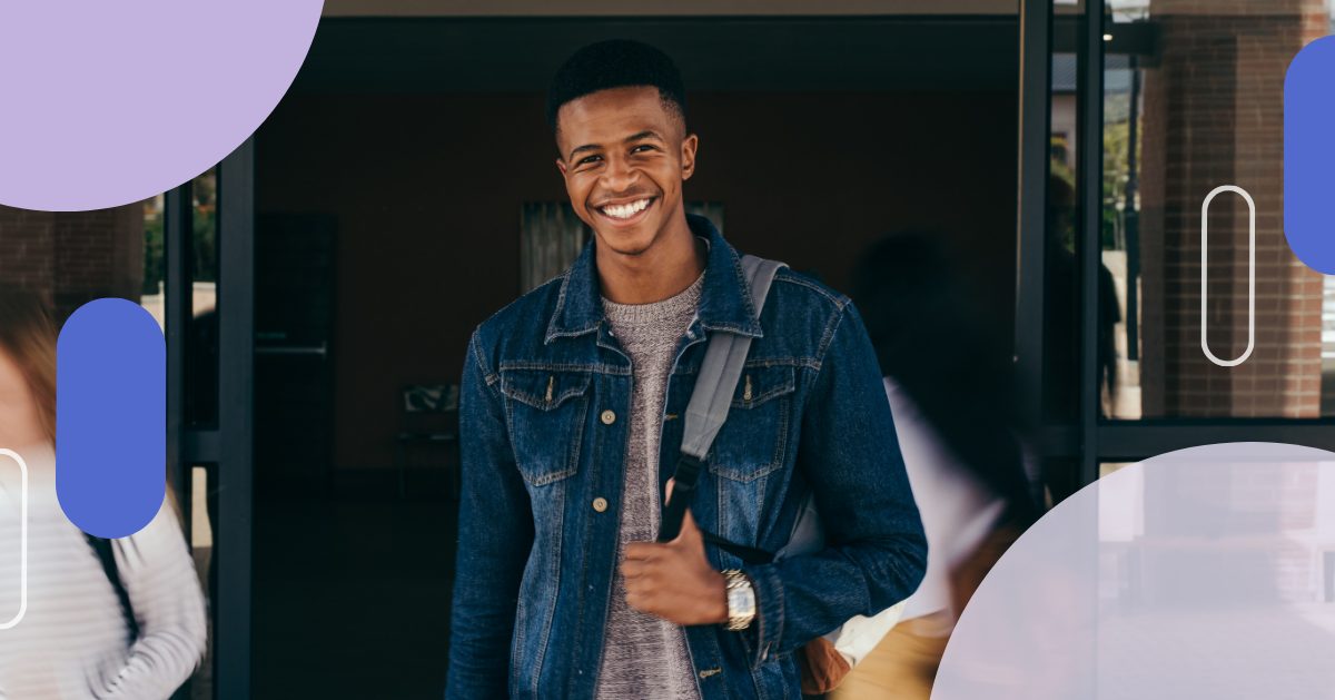 College student smiling outside a campus building