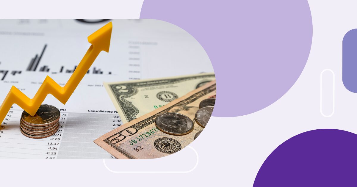 U.S. currency and coins on top of charts, with a yellow arrow rising upward, symbolizing financial growth or positive return on investment
