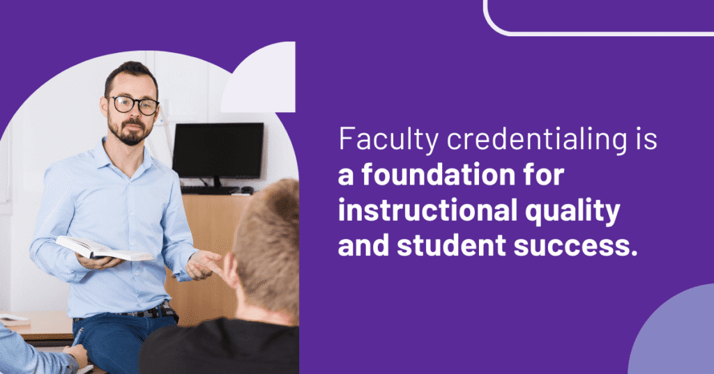 Faculty member teaching a class while holding a book and engaging with students