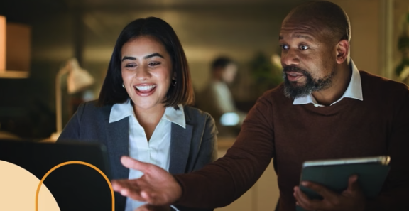 Two people looking at a computer screen