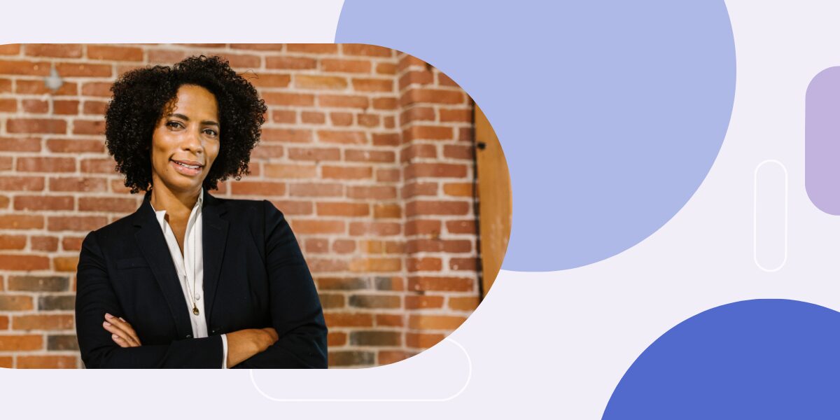 Photo of woman in business suit with arms crossed