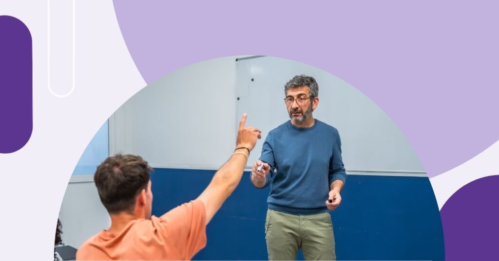 student raising hand and teacher pointing to him