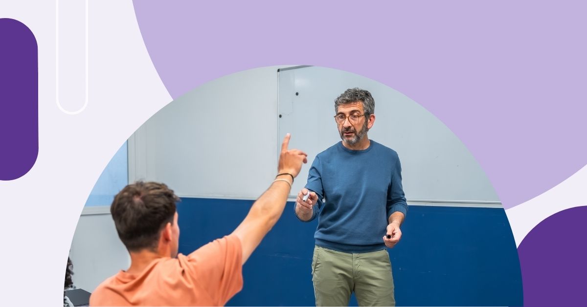 student raising hand and teacher pointing to him